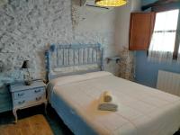 Postel nebo postele na pokoji v ubytování Casa Rural tía Salomé