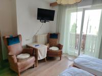 Televízia a/alebo spoločenská miestnosť v ubytovaní Garni Hattlerhof B&B