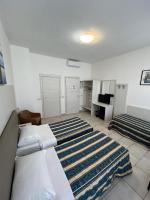 A bed or beds in a room at Hotel Alessander