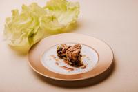 a plate of food with lettuce on a table at Locanda Solagna in Quero