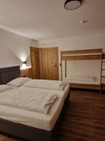 a bedroom with two beds and a bunk bed at Haus Rätikon in Brand