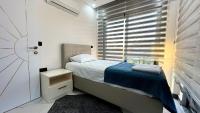 Postel nebo postele na pokoji v ubytování Serenity Villa