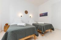 Posteľ alebo postele v izbe v ubytovaní Naxos Beachwalk Rooms