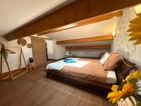 a bedroom with a bed in a room with at Maison piscine &amp; spa Vallon Pont d&#39;Arc in Vallon-Pont-dʼArc