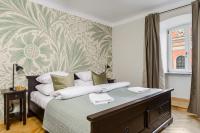 Posteľ alebo postele v izbe v ubytovaní P&O Podwale Apartments