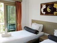 Ein Bett oder Betten in einem Zimmer der Unterkunft Ampha Place Hotel