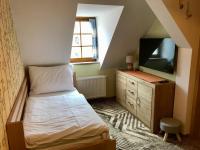 Telewizja i/lub zestaw kina domowego w obiekcie Golden Wood Apartments