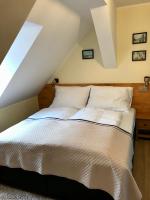 Łóżko lub łóżka w pokoju w obiekcie Golden Wood Apartments