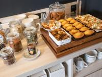 a buffet with bread and other food on a table at ibis Styles Porto Vecchio in Porto-Vecchio