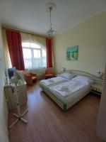 Łóżko lub łóżka w pokoju w obiekcie Hotel Familia