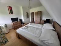 Łóżko lub łóżka w pokoju w obiekcie Hotel Familia