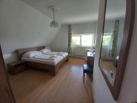 Łóżko lub łóżka w pokoju w obiekcie Hotel Familia