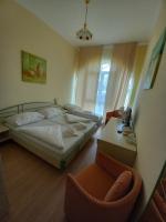 Łóżko lub łóżka w pokoju w obiekcie Hotel Familia