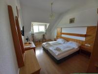 Łóżko lub łóżka w pokoju w obiekcie Hotel Familia