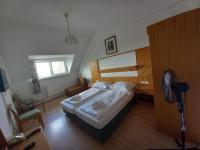 Łóżko lub łóżka w pokoju w obiekcie Hotel Familia