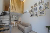 a living room with a couch and a kitchen at PanMari in Paphos City