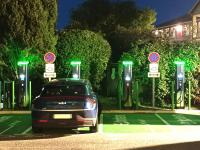 a car parked in a parking lot with green lights at Cit&#39;Hotel Hotel Prime - A709 in Saint-Jean-de-Védas