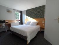 a hotel room with a bed and a window at Cit&#39;Hotel Hotel Prime - A709 in Saint-Jean-de-Védas