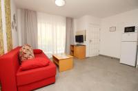 Televízia a/alebo spoločenská miestnosť v ubytovaní Villas Corinthia