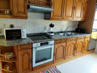 Kuchyň nebo kuchyňský kout v ubytování Apartamento en el casco antiguo de Ponferrada