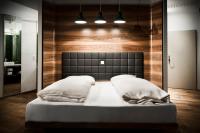A bed or beds in a room at Hotel Daniel Vienna - Smart Lifestyle Near City Centre