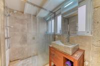 a bathroom with a sink and a shower at GuestReady - Stonewall Mezzanine in Brotteaux in Lyon
