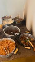 a group of bowls of food on a table at Complexo Luquinha in Iacaiá
