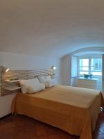 A bed or beds in a room at Casa di Via Porta Dipinta