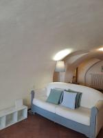 A bed or beds in a room at Casa di Via Porta Dipinta