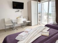 Posteľ alebo postele v izbe v ubytovaní Apartments Irma
