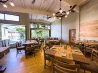 a dining room with wooden tables and chairs at HADCO Experiences at Asa Wright Nature Centre in Blanchisseuse