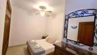 Postel nebo postele na pokoji v ubytování Sunny Beach Aloha Apartment