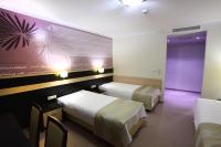 Łóżko lub łóżka w pokoju w obiekcie Hotel Vitalia