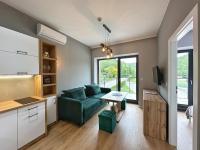 Televízia a/alebo spoločenská miestnosť v ubytovaní Apartamenty KAPRYS - Centrum