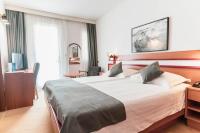 Posteľ alebo postele v izbe v ubytovaní Hotel Horizont