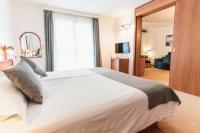 Posteľ alebo postele v izbe v ubytovaní Hotel Horizont