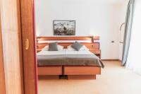Posteľ alebo postele v izbe v ubytovaní Hotel Horizont