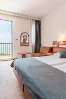 Posteľ alebo postele v izbe v ubytovaní Hotel Horizont