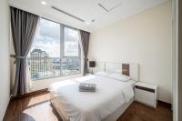 Vinhomes Residences Luxury Suiteにあるベッド