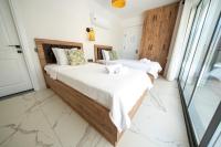 A bed or beds in a room at Olive Hills Villa - Family-Friendly Luxury Villa Yesiluzumlu Fethiye by Sunworld Villas