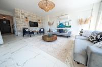 A television and/or entertainment centre at Olive Hills Villa - Family-Friendly Luxury Villa Yesiluzumlu Fethiye by Sunworld Villas