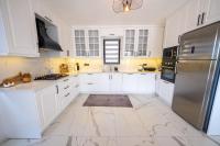 A kitchen or kitchenette at Olive Hills Villa - Family-Friendly Luxury Villa Yesiluzumlu Fethiye by Sunworld Villas