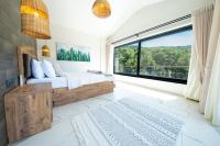 A bed or beds in a room at Olive Hills Villa - Family-Friendly Luxury Villa Yesiluzumlu Fethiye by Sunworld Villas