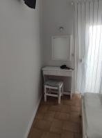 Televízia a/alebo spoločenská miestnosť v ubytovaní Vetti Rooms