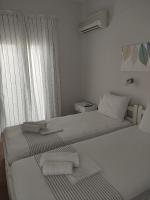 Posteľ alebo postele v izbe v ubytovaní Vetti Rooms