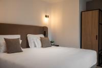 A bed or beds in a room at Residence - Palais Hörtenberg
