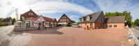 a group of houses on a brick street at Landhotel Zur Linde in Verden