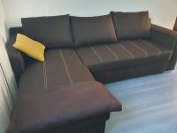 a brown couch with a yellow pillow on it at Holiday house Giovanna in Vojnić