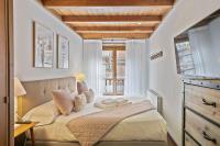 A bed or beds in a room at Luderna - Apartamento Val de Ruda A4 Montpius
