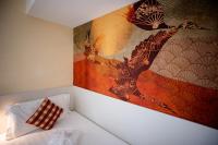 Posteľ alebo postele v izbe v ubytovaní Hotel Arizona